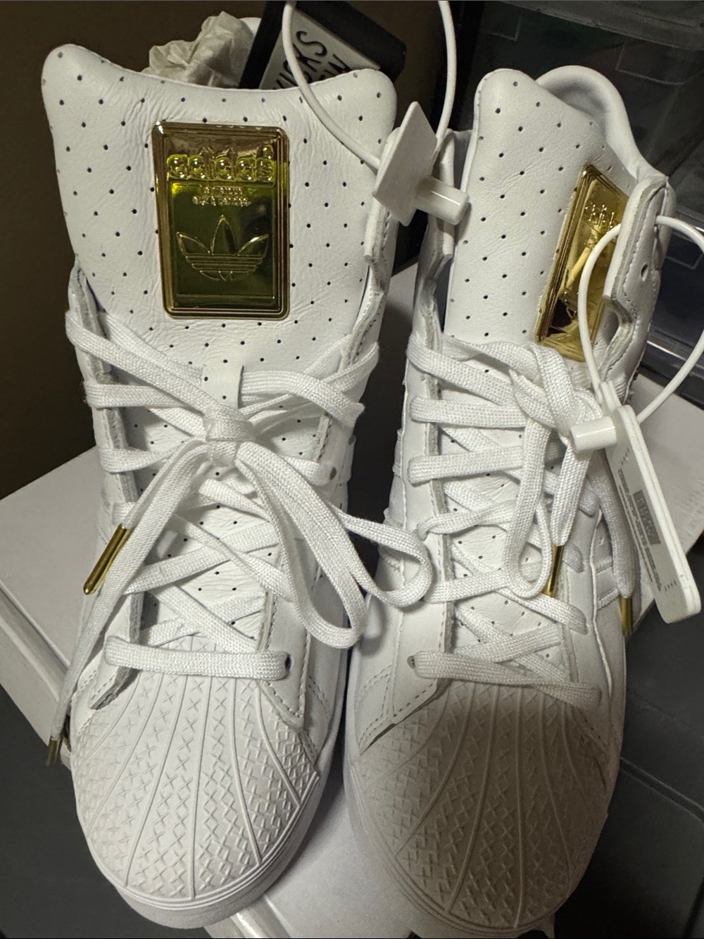 adidas White High-Top Sneakers with Gold Accents